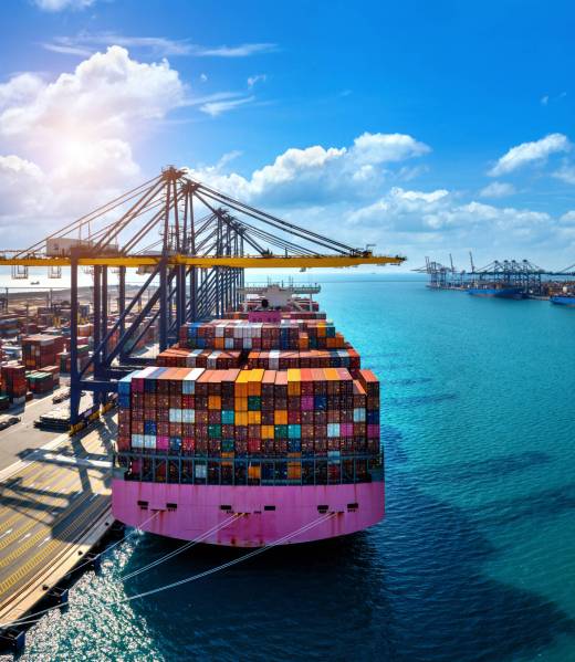 Aerial view of cargo ship and cargo container in harbor. Aerial view of cargo ship and cargo container in harbor.
