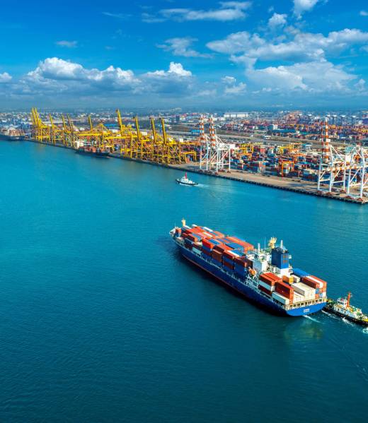 Aerial view of cargo ship and cargo container in harbor. Aerial view of cargo ship and cargo container in harbor.